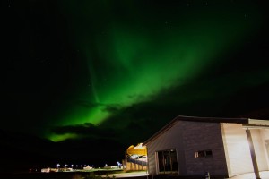 northern lights from the swimming pool in eskifjordur iceland aurora borealis        